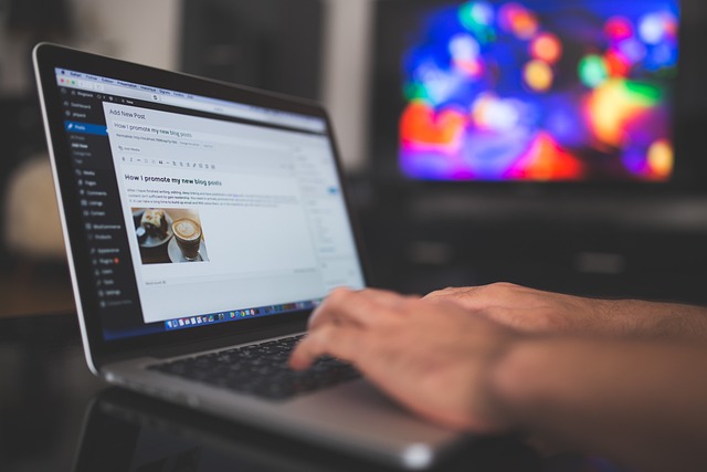 A person typing on a laptop with a WordPress interface, showcasing a blog post titled "How I promote my new living posts" while a colorful TV screen is visible in the background.